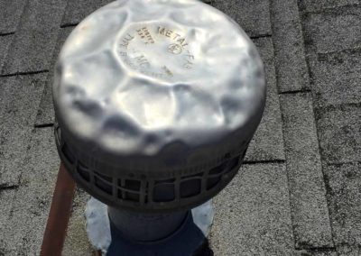 Dented roof vent from hail storm
