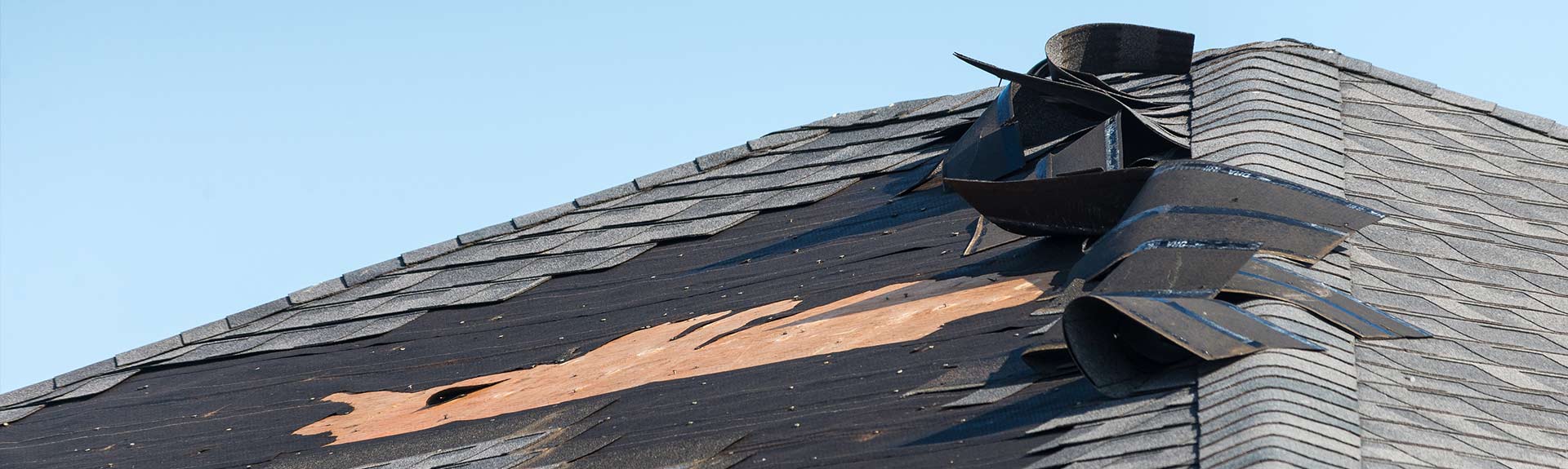 Torn Shingles Need Emergency Roof Repair