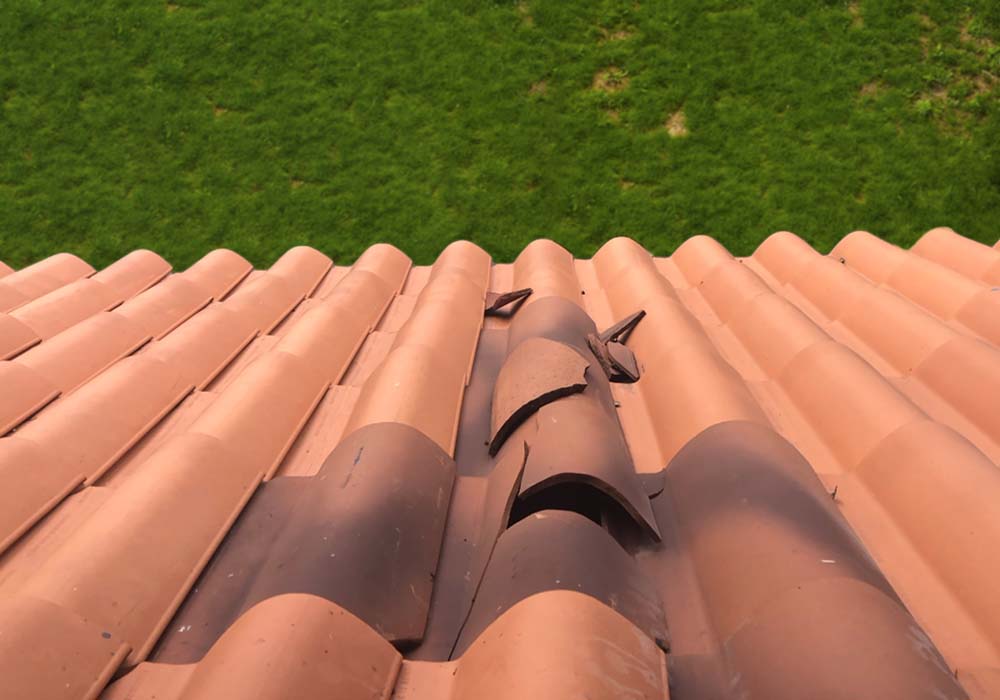 Wind Damaged Cracked Roof Tiles