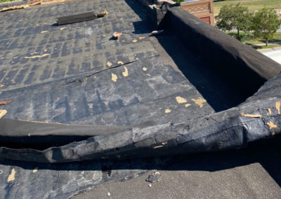 Torn Flat Roof Wind Damage