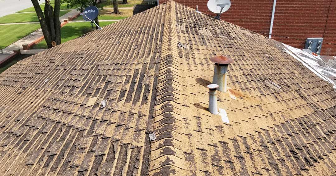 Worn Out Roof Shingles Looking From Peak